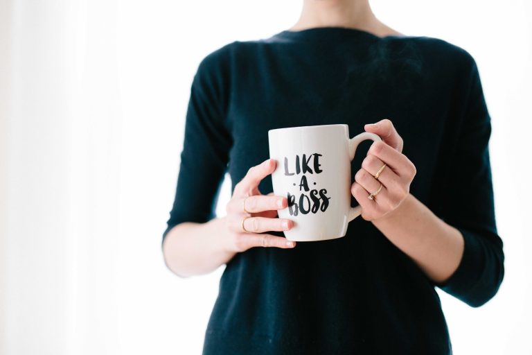 a person holding a mug