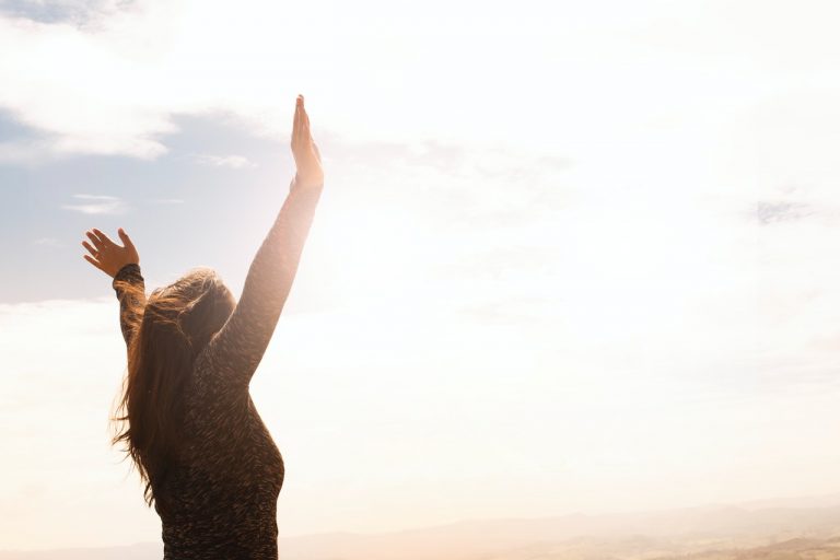 a person raising the hands