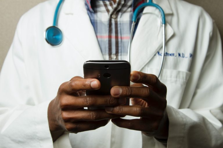 a doctor holding a tablet