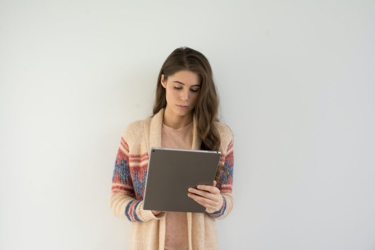 a woman holding a tablet